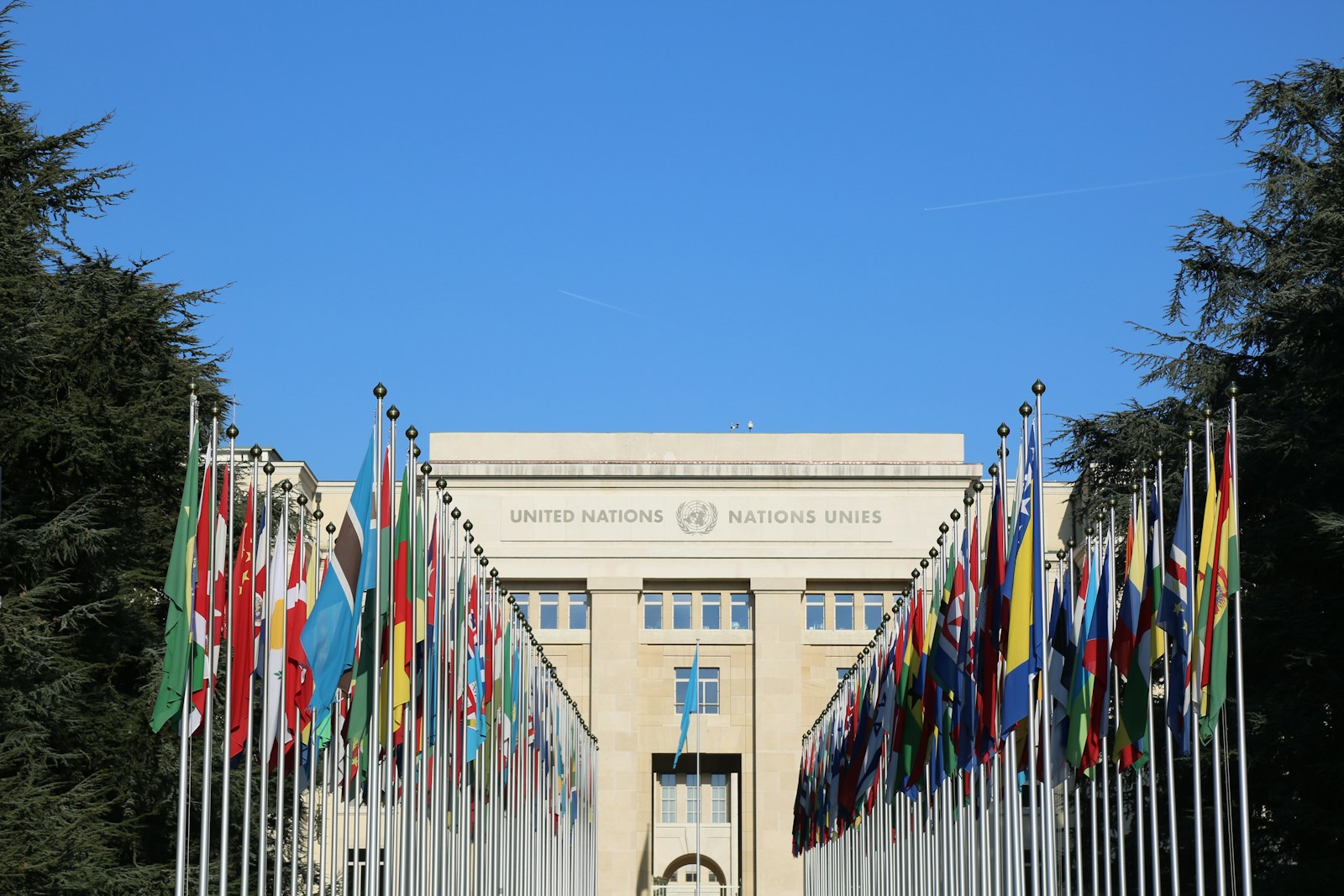 National flags in front of the United Nations building in Geneva